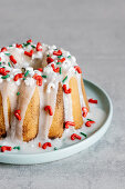 Bundt cake decorated with sugar glaze and Christmas sprinkles