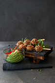 Asian pork and prawn meatballs with avocado dip