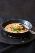 Cream soup made from mushrooms, spring onions and tomatoes