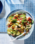 Zucchini salad with 'straciatella', peas and chorizo dressing