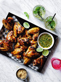 Chilli caramel wings with peanut coriander relish, and mint julep