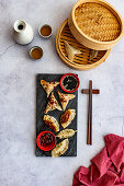 Steamed prawn dumplings and chicken pot stickers with chilli oil