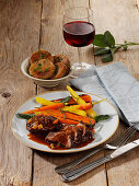 Thuringian pork cheeks with colorful carrots and bread dumplings