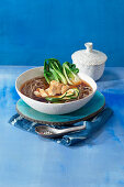 Japanese ramen with chicken and pak choi