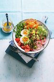 Spicy breakfast bowl with avocado, radishes and egg