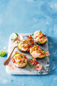 Avocado Ritz with prawns, tomatoes and spicy cocktail sauce