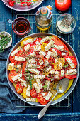 Tomatoes baked with feta, herbs and olive oil