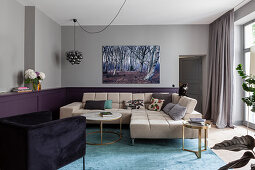 Beige sofa set in living room with purple wainscoting