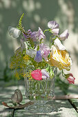 Bouquet of rose blossoms, sweet peas, obedient plant, and dill