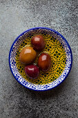 Delicious ripe black olives in a bowl