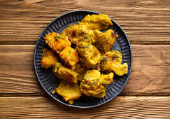 Indian fried assorted pakoras on wooden rustic background