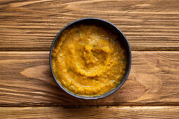 Indian Dal soup on wooden rustic background