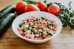 Healthy cucumber and tomato salad with chickpeas and parsley
