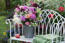 Fragrant late summer bouquet with phlox, hydrangeas, roses, bluebells, amaranth and annual fleabane