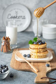 Cottage cheese pancakes with blueberries and honey