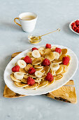 Mini pancakes with raspberry and banana