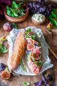 Baguette sandwich with prosciutto and figs