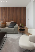 Dark wooden fitted cupboards in modern living room