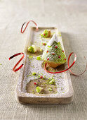 Christmas tree cakes with pistachio nuts and pomegranate jelly