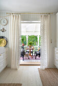 A view from a kitchen onto a terrace