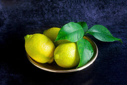 Lemons in a metal dish