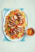 Spicy Korean pork with grilled corn and rice salad
