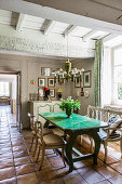 Table with green glazed ceramic top in dining room