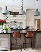 Pendant lights above kitchen breakfast bar