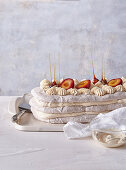 Walnut meringue with plums