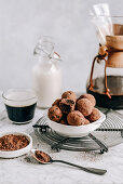 Vegan date and nut truffles dipped in cocoa