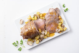 Roast veal with porcini mushrooms and potato cubes