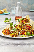 Burritos with minced chilli and a pepper medley