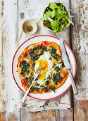 Spinach goat cheese and baked egg pizza