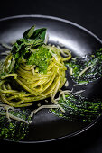 Pasta with pesto sauce and Parmesan cheese