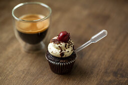 A black forest and cherry cupcake