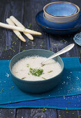 Cream of white asparagus soup with garden cress