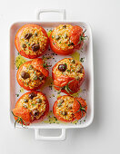 Tomatoes filled with rice, capers and olives