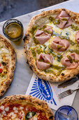 Pizza with mortadella and pistachios