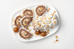 Chocolate and chestnut Swiss roll filled with cream and almonds