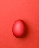 Red Easter egg on a red background