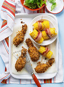 Crunchy buttermilk chicken wings with corn cobs
