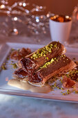 Filo rolls with chocolate cream and pistachios