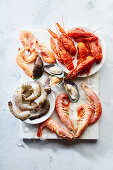 Assortment of various raw seafood - shrimps, kiwi mussels, squid and crawfish