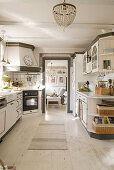 Country-house-style kitchen with white floor and grey accents