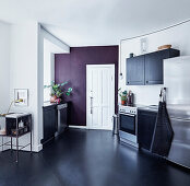 Contemporary kitchen with black linoleum floor