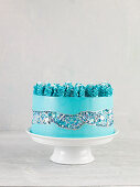 A caramel cake with turquoise icing
