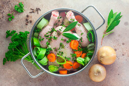 Ingredients for chicken broth in a pot