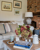 Hydrangeas on coffee table in country-house-style living room