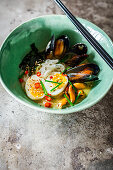 Poached mussels served Ramen style