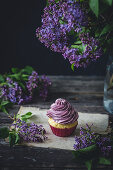 Vanilla cupcake with purple frosting